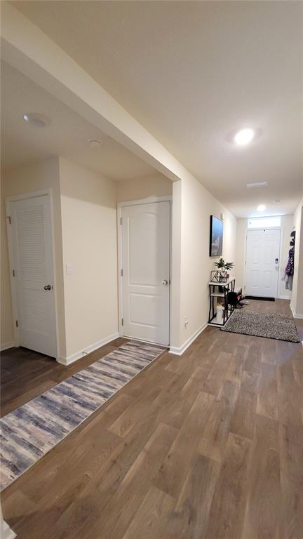 An interior hallway features light-colored walls, wood-look flooring, and two white doors — 36 RYARBOR DRIVE, PALM COAST, FL