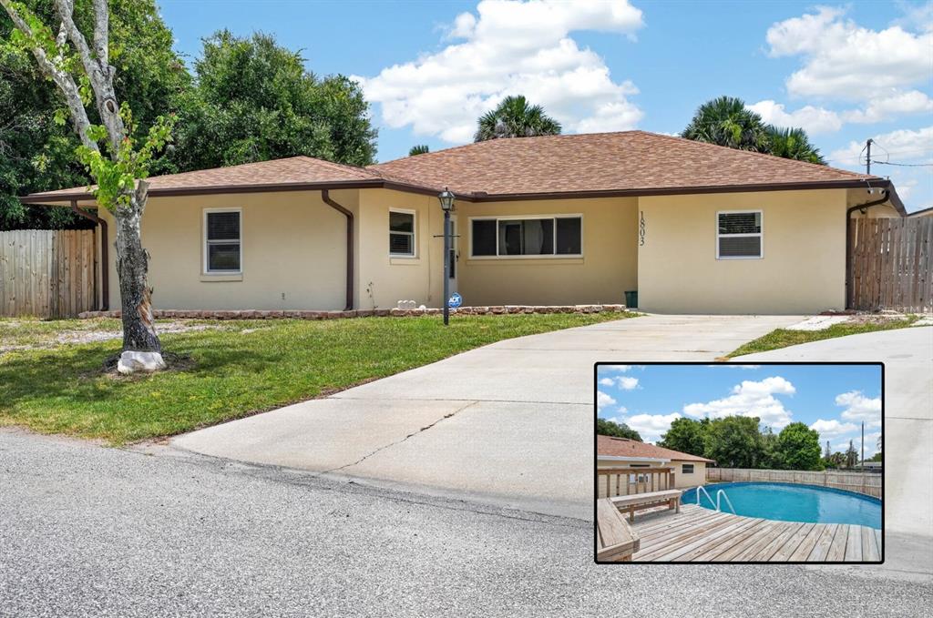 A single-story house with a beige exterior and a driveway, featuring an inset pool photo — 1803 EVERGREEN DRIVE, EDGEWATER, FL
