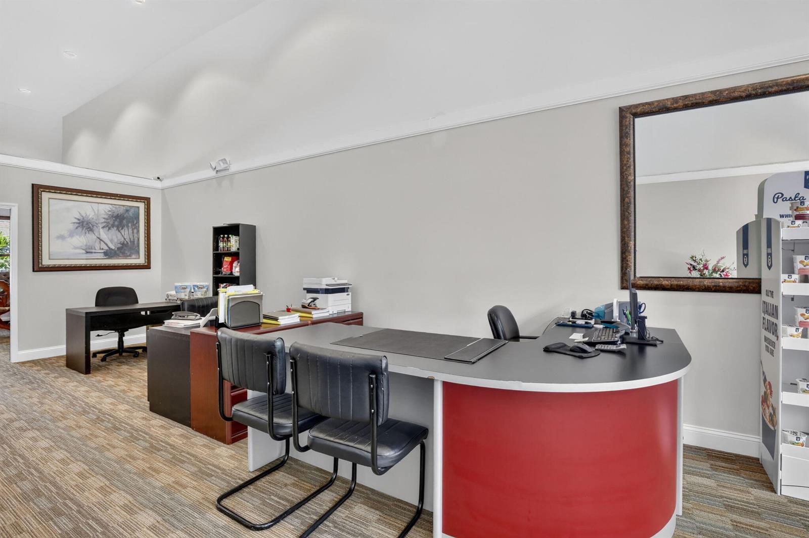 An office space features a curved red reception desk, two black chairs, and a desk area — 5200 S University Drive # 103a, Davie FL 33328, DAVIE, FL