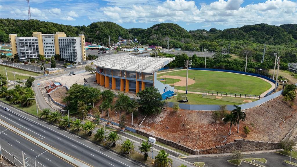 An aerial view of a baseball stadium next to a large hotel and highway — 7 CALLE OPALO, AGUADILLA, PR