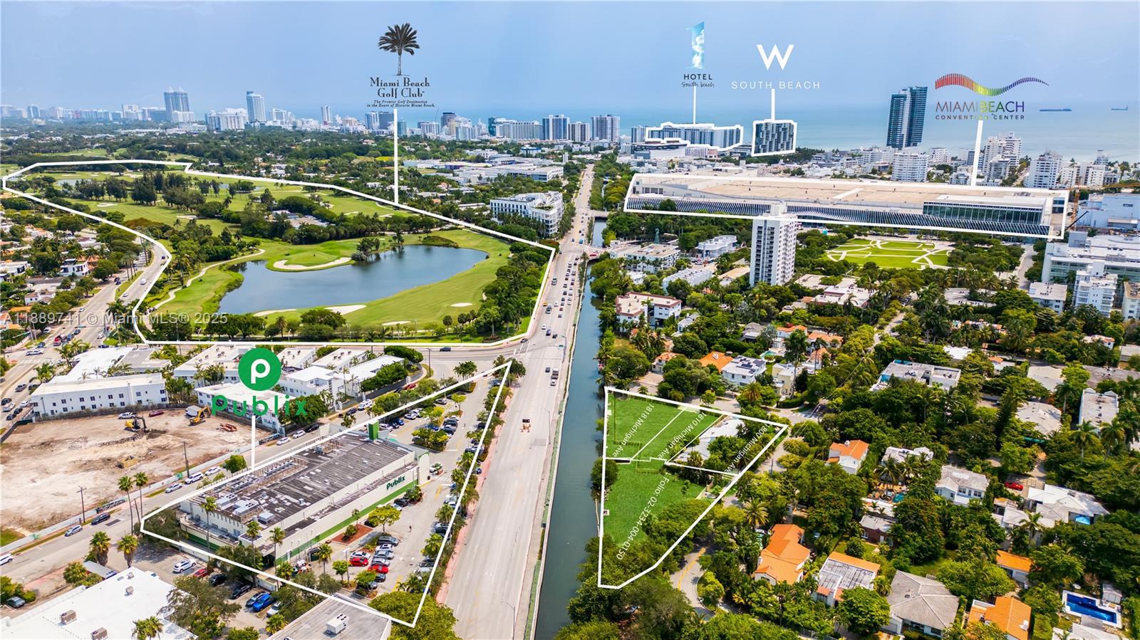 This aerial view shows a canal separating a Publix supermarket from a vacant residential lot — 18th st Michigan Ave, Miami Beach FL 33139, MIAMI BEACH, FL