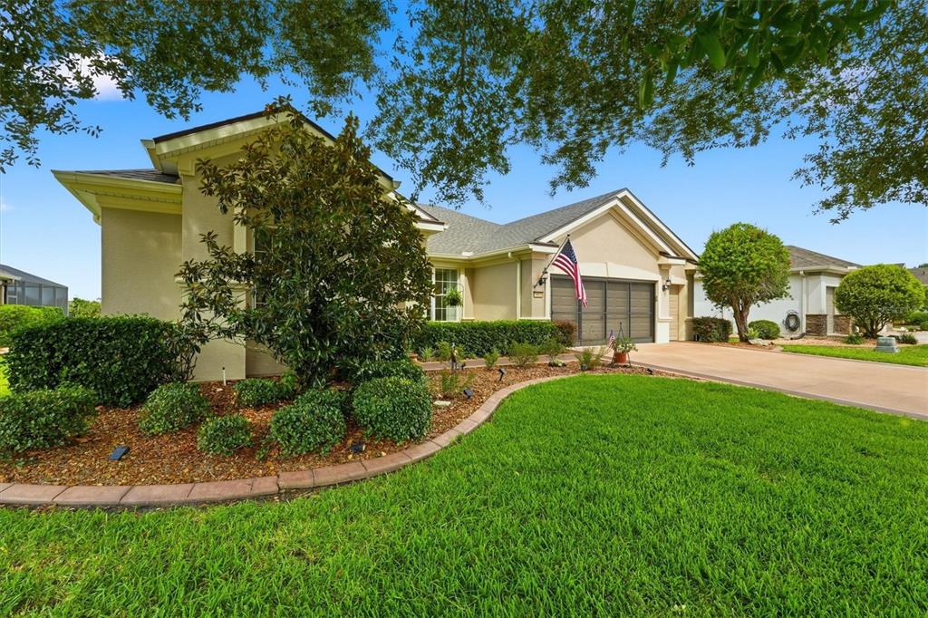 An entryway features a white front door, tile flooring, a wooden bench, and a mirror — 6865 SW 97TH TERRACE ROAD, OCALA, FL