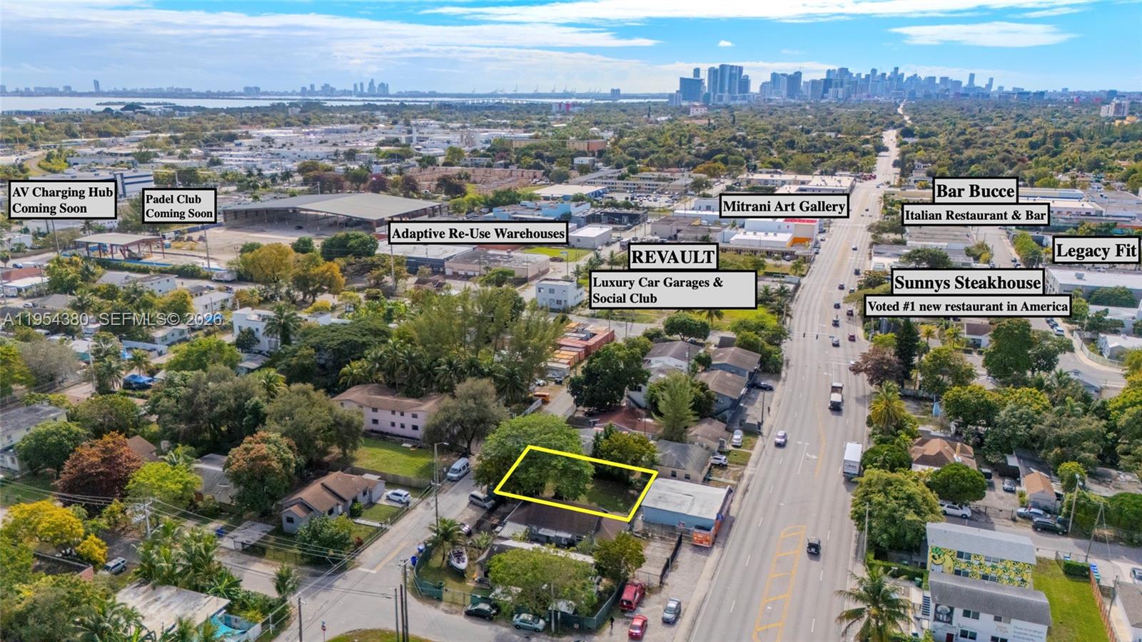 This aerial view shows a vacant lot highlighted in yellow near a commercial street — 7552 NE Miami Ct, Miami FL 33138, MIAMI, FL