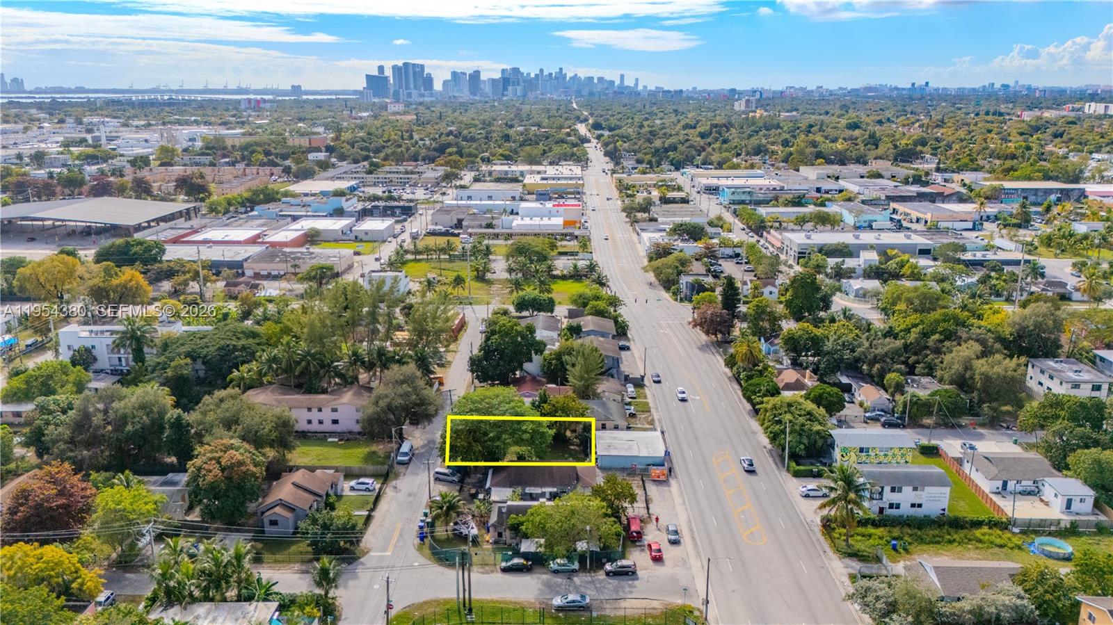 An aerial view shows a rectangular vacant lot outlined in yellow near a city street — 7552 NE Miami Ct, Miami FL 33138, MIAMI, FL