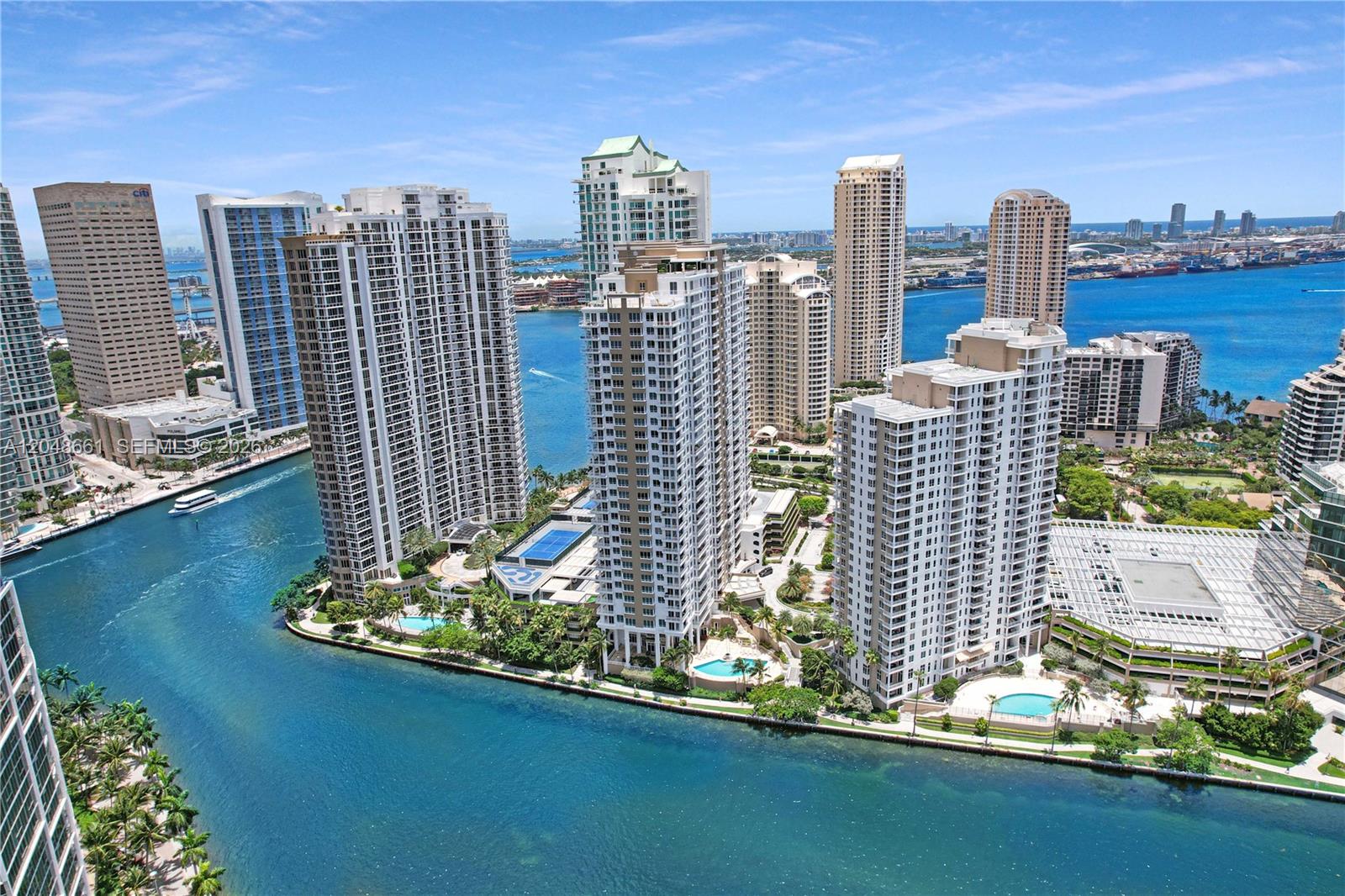 An aerial view of high-rise residential buildings situated along a waterfront in a city — 801 Brickell Key Blvd # 2210, Miami FL 33131, MIAMI, FL