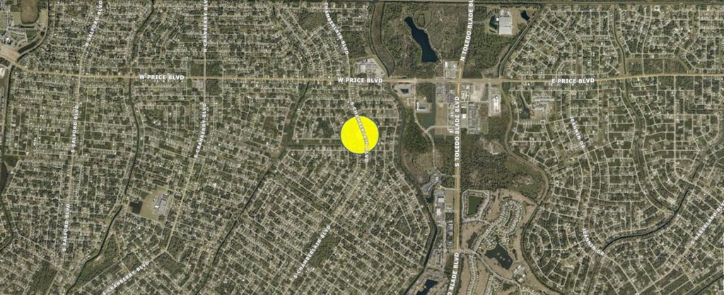 This is an aerial map showing a residential area with a yellow circle highlighting a location — S CHAMBERLAIN BOULEVARD, NORTH PORT, FL