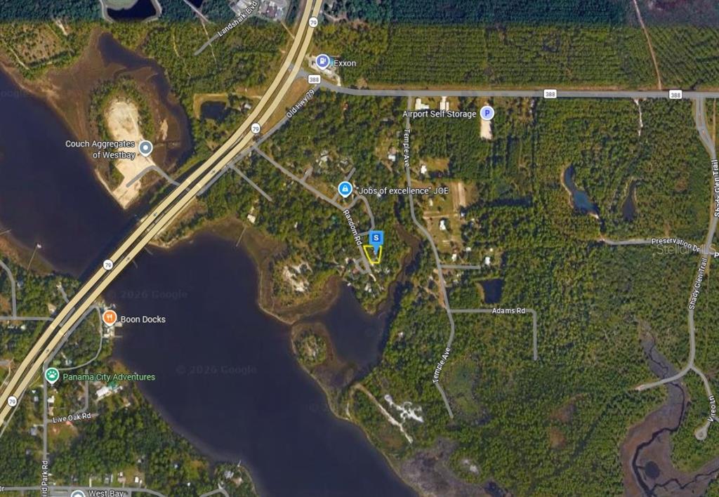 This is a satellite map showing roads, bodies of water, and businesses in West Bay — 7905 RANDOM ROAD, PANAMA CITY BEACH, FL