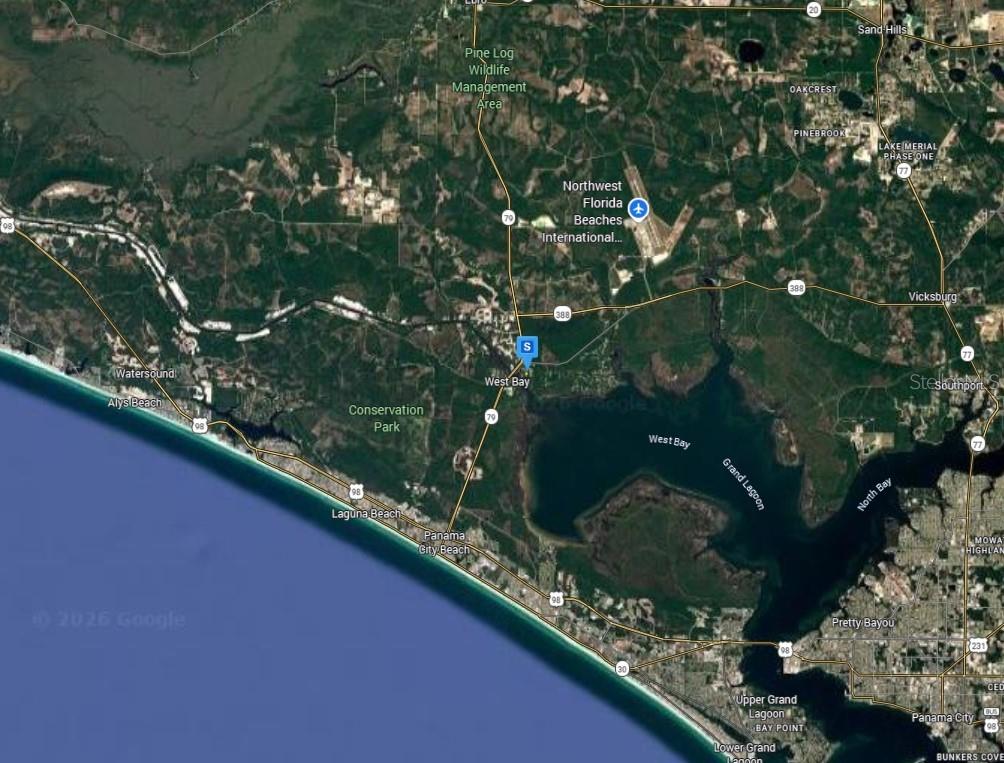 This is a satellite map showing the area around West Bay and Panama City, Florida — 7905 RANDOM ROAD, PANAMA CITY BEACH, FL