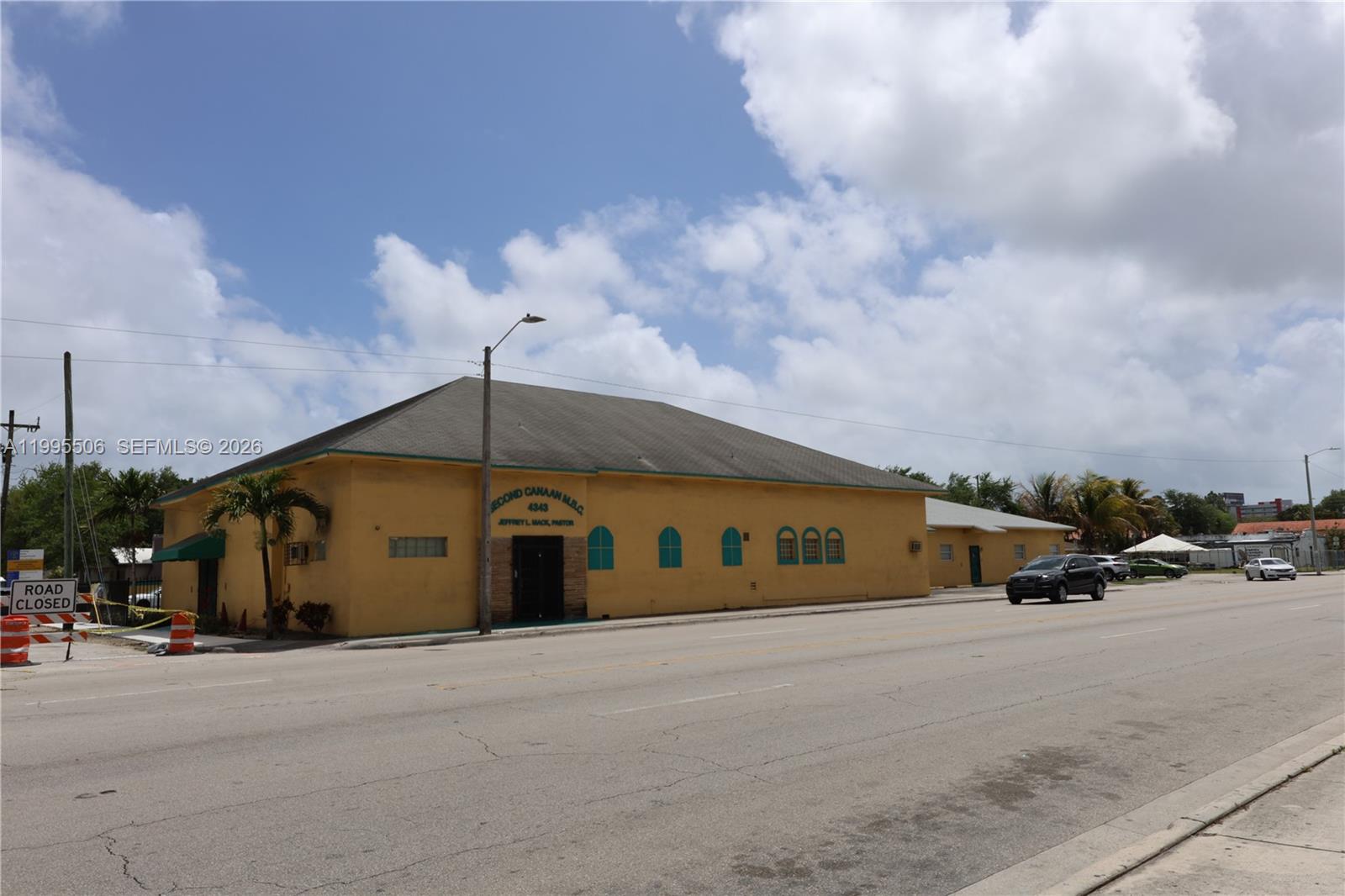 A yellow church building sits along a street with a road closed sign nearby — 4343 NW 17th Ave, Miami FL 33142, MIAMI, FL