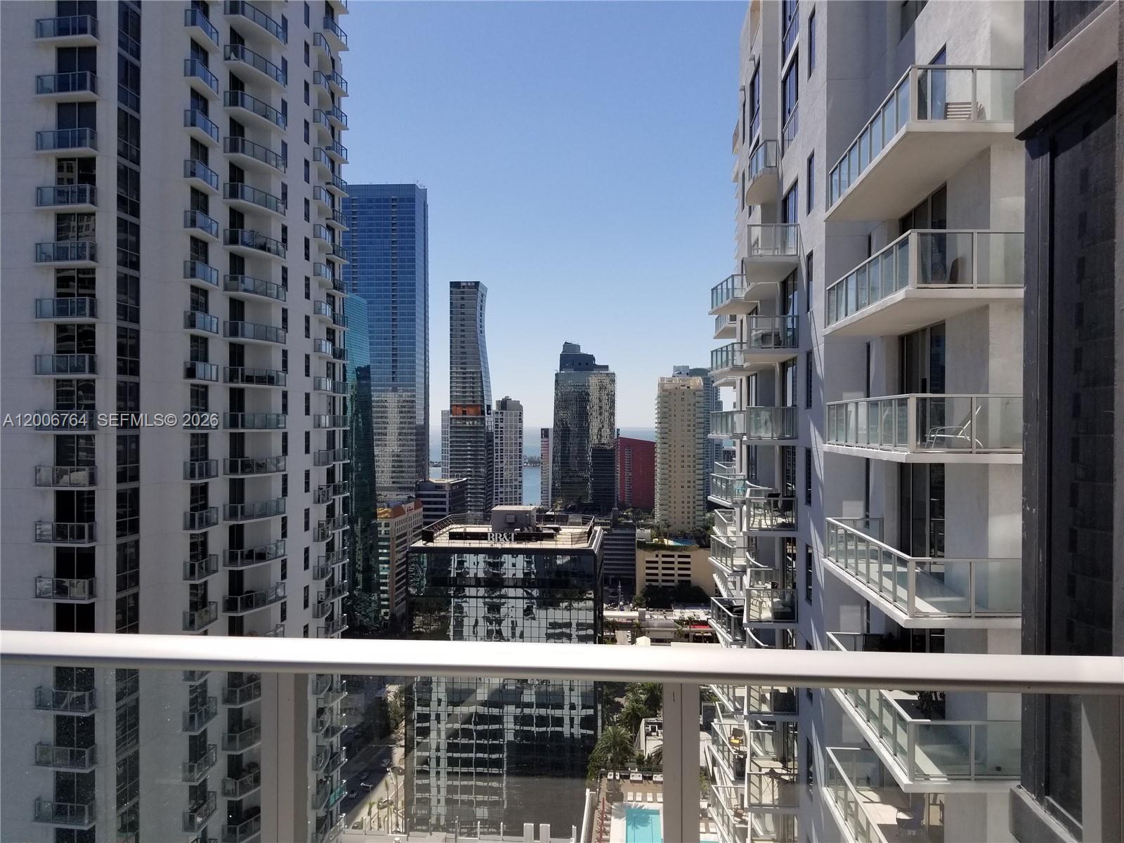 A view of a city skyline from a high-rise balcony between two residential towers — 1010 Brickell Ave # 3205, Miami FL 33131, MIAMI, FL