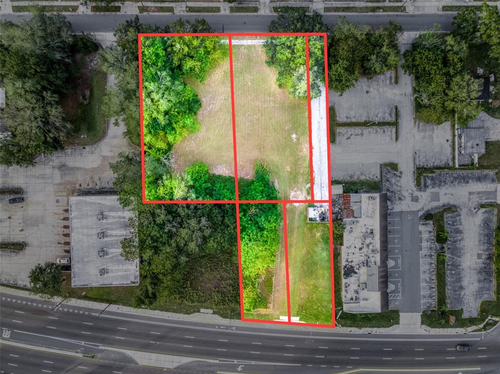 An aerial view shows two adjacent vacant lots outlined in red along a busy road — 0 W STATE ROAD 60, LAKE WALES, FL