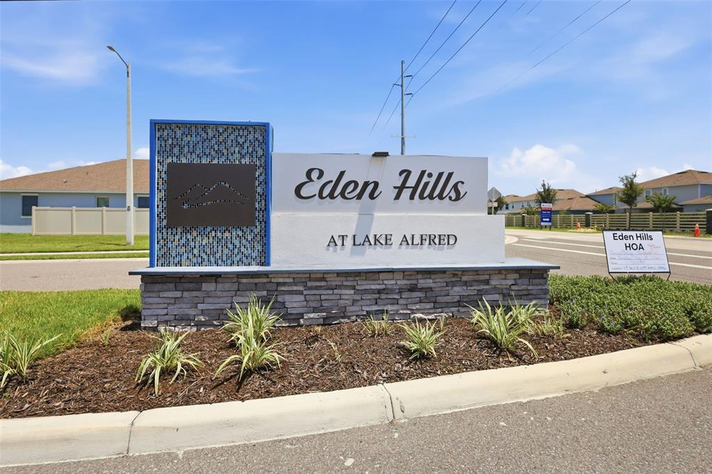 A stone and stucco monument sign for the Eden Hills at Lake Alfred community — 832 GRIFFON AVENUE, LAKE ALFRED, FL