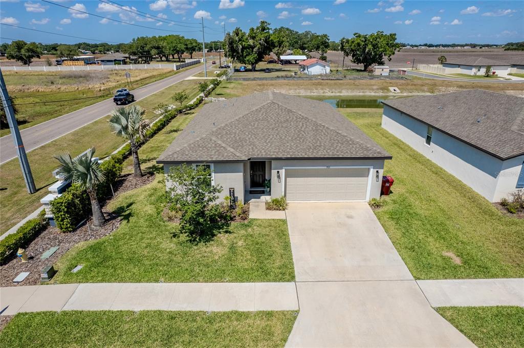An aerial view of a single-story house with a two-car garage and a concrete driveway — 3521 BONSILVA STREET, PLANT CITY, FL