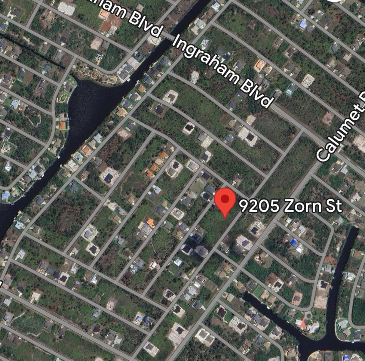 This is a satellite map view showing a residential neighborhood with a marked property location — 9205 Zorn Street, FL 33981, FL
