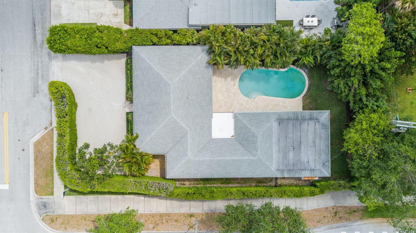 An aerial view shows a house with a gray roof, a pool, and surrounding landscaping — 246 Gray Street, West Palm Beach FL 33405, WEST PALM BEACH, FL