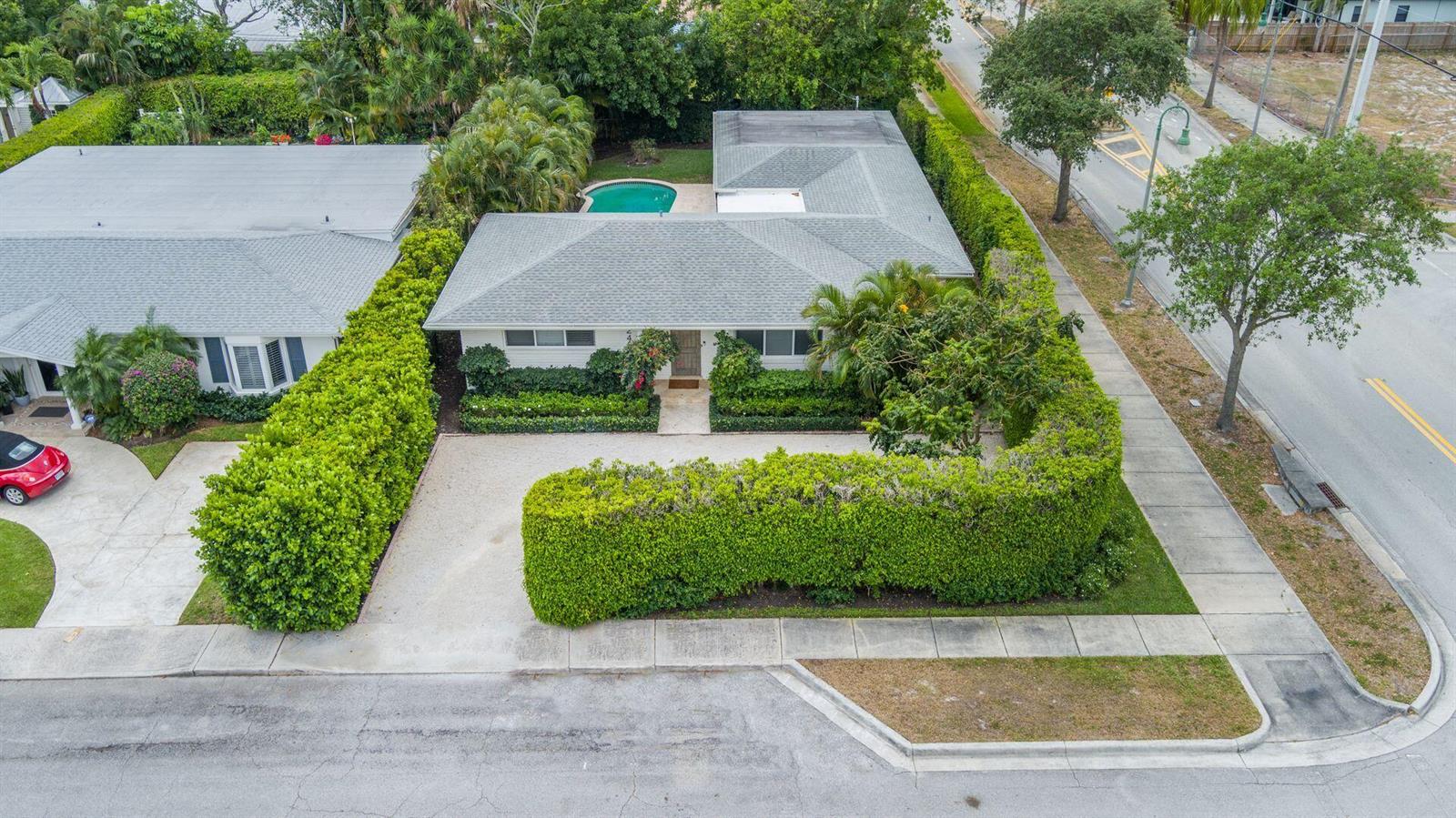 An aerial view shows a single-story house with a gravel driveway and a swimming pool — 246 Gray Street, West Palm Beach FL 33405, WEST PALM BEACH, FL