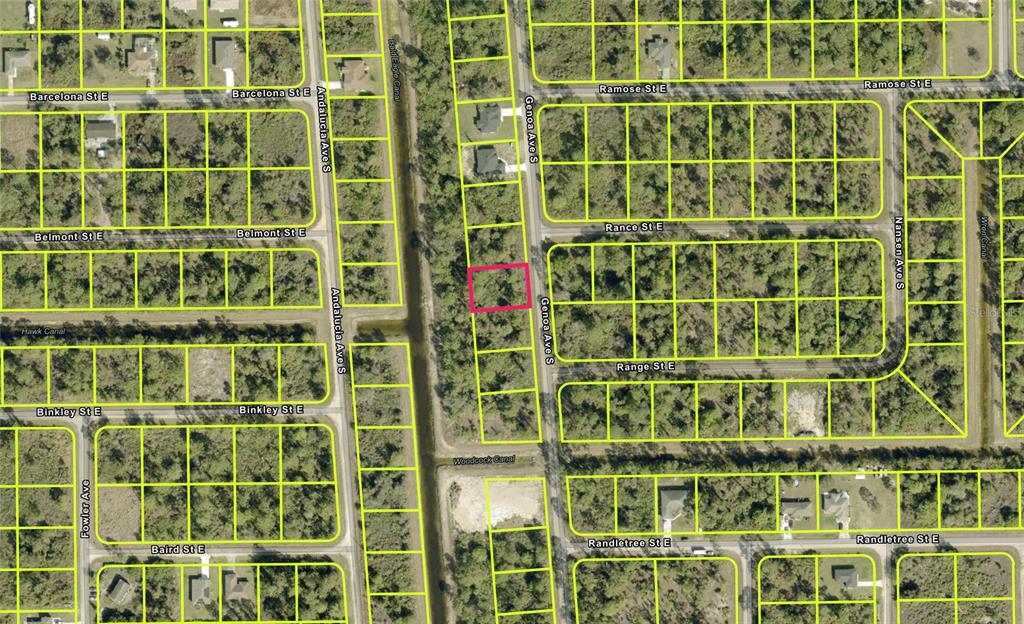 This is an aerial map showing a vacant lot highlighted in pink along a street — 216 GENOA AVENUE S, LEHIGH ACRES, FL