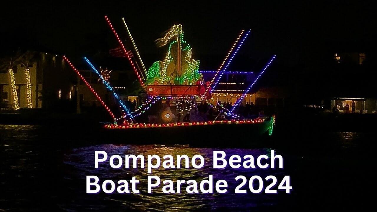 A decorated boat with colorful holiday lights floats on the water at night — 1401 N Riverside Drive N # 307, Pompano Beach FL 33062, POMPANO BEACH, FL