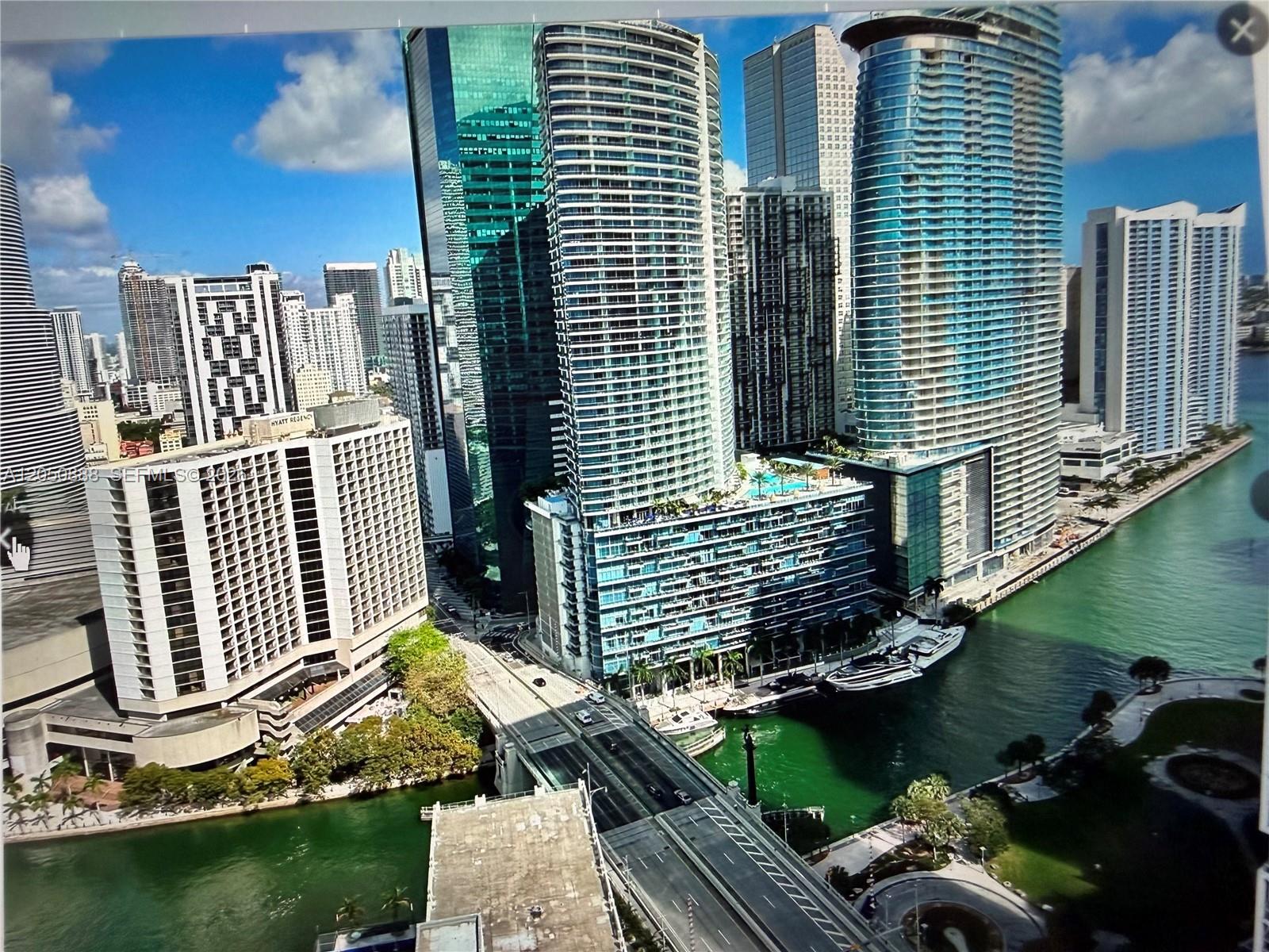 An elevated view of the Miami River, surrounding skyscrapers, and a bridge in downtown Miami — 500 Brickell Ave # 2003, Miami FL 33131, MIAMI, FL