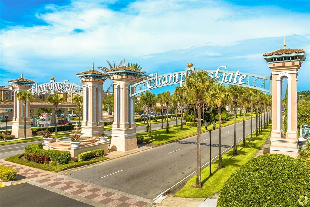 The entrance to ChampionsGate features large decorative pillars and a prominent arched sign — 1476 MOON VALLEY DRIVE, DAVENPORT, FL