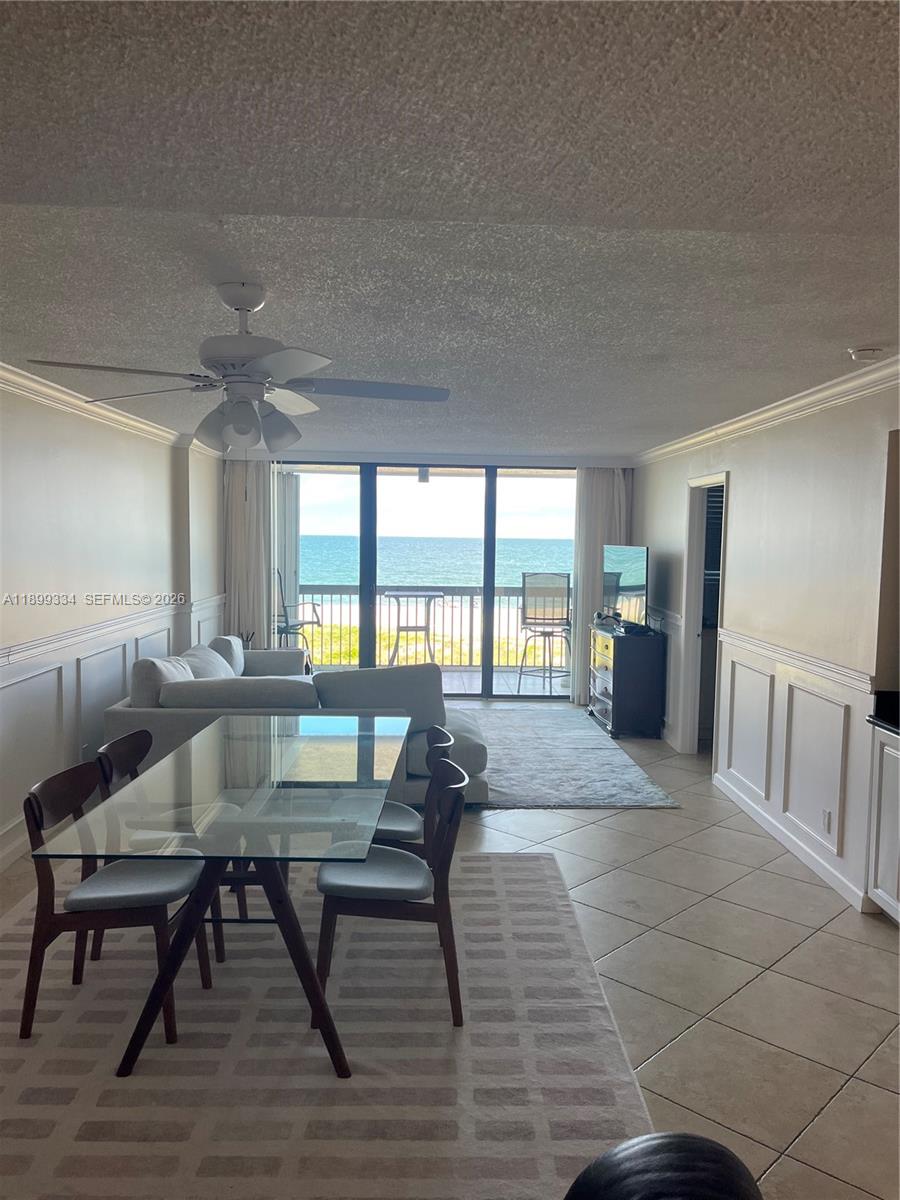 An outdoor swimming pool sits on a patio overlooking a beach and the ocean — 510 N Ocean Blvd # 211, Pompano Beach FL 33062, POMPANO BEACH, FL