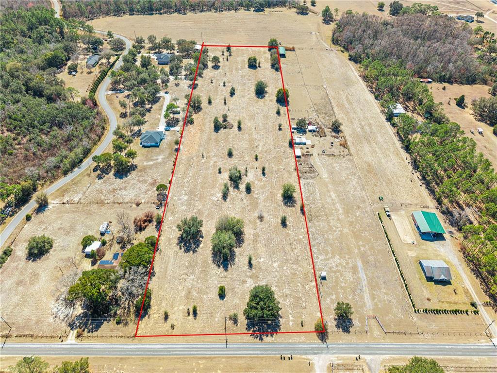An aerial view shows a large, rectangular plot of land outlined in red — GREEN SWAMP ROAD, CLERMONT, FL