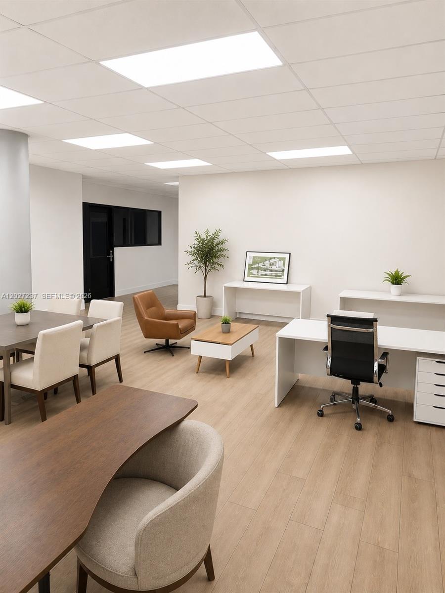 This office space features light wood flooring, white desks, and a modern seating area — 3505 S Ocean Dr, Hollywood FL 33019, HOLLYWOOD, FL