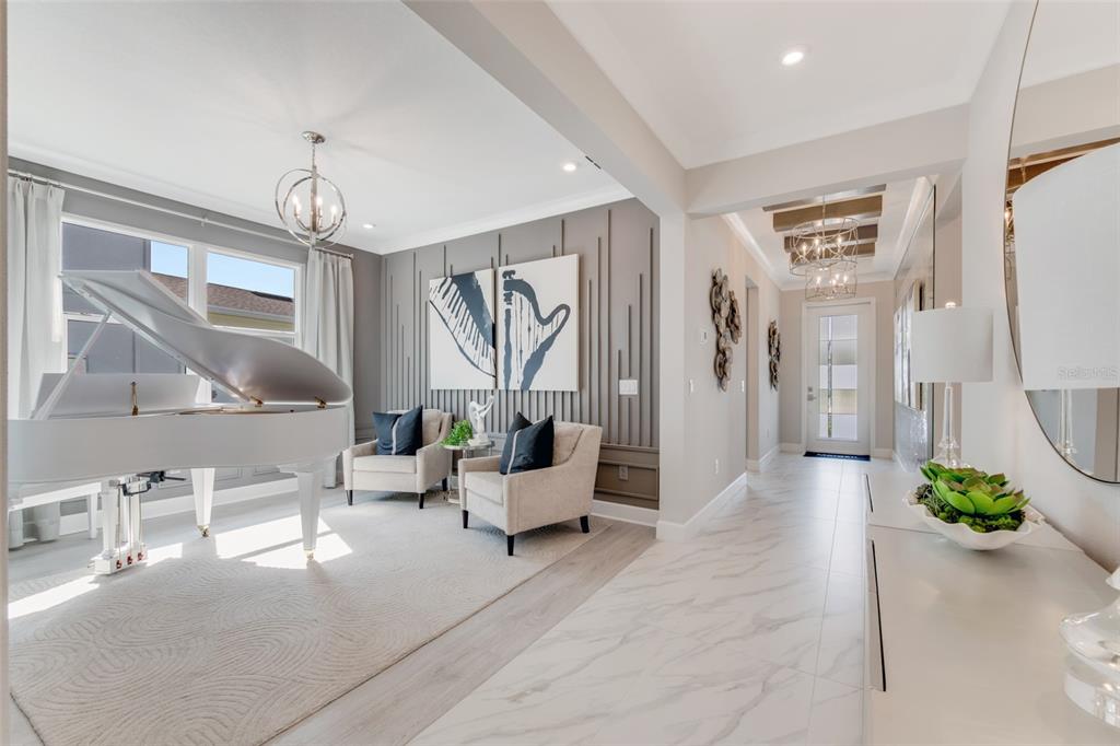 A white grand piano sits in a living area next to a hallway with tile floors — 1193 CRESSWIND BOULEVARD, DELAND, FL