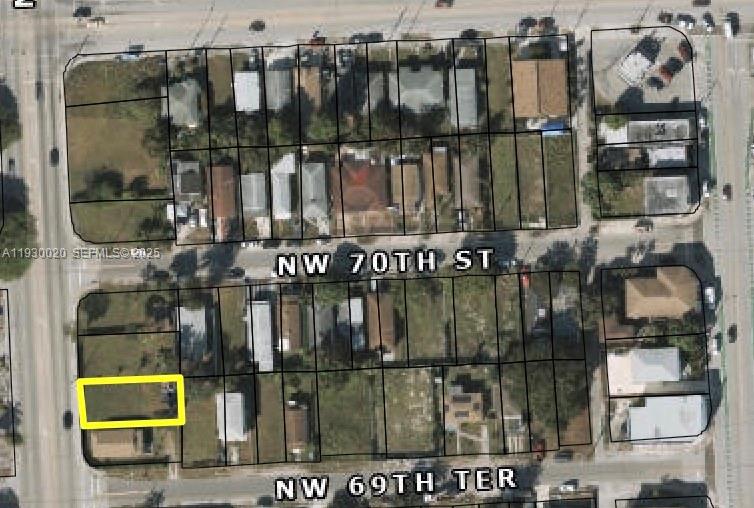 This is an aerial map showing a residential neighborhood with a specific lot highlighted in yellow — 6973 NW 17th Ave, Miami FL 33147, MIAMI, FL