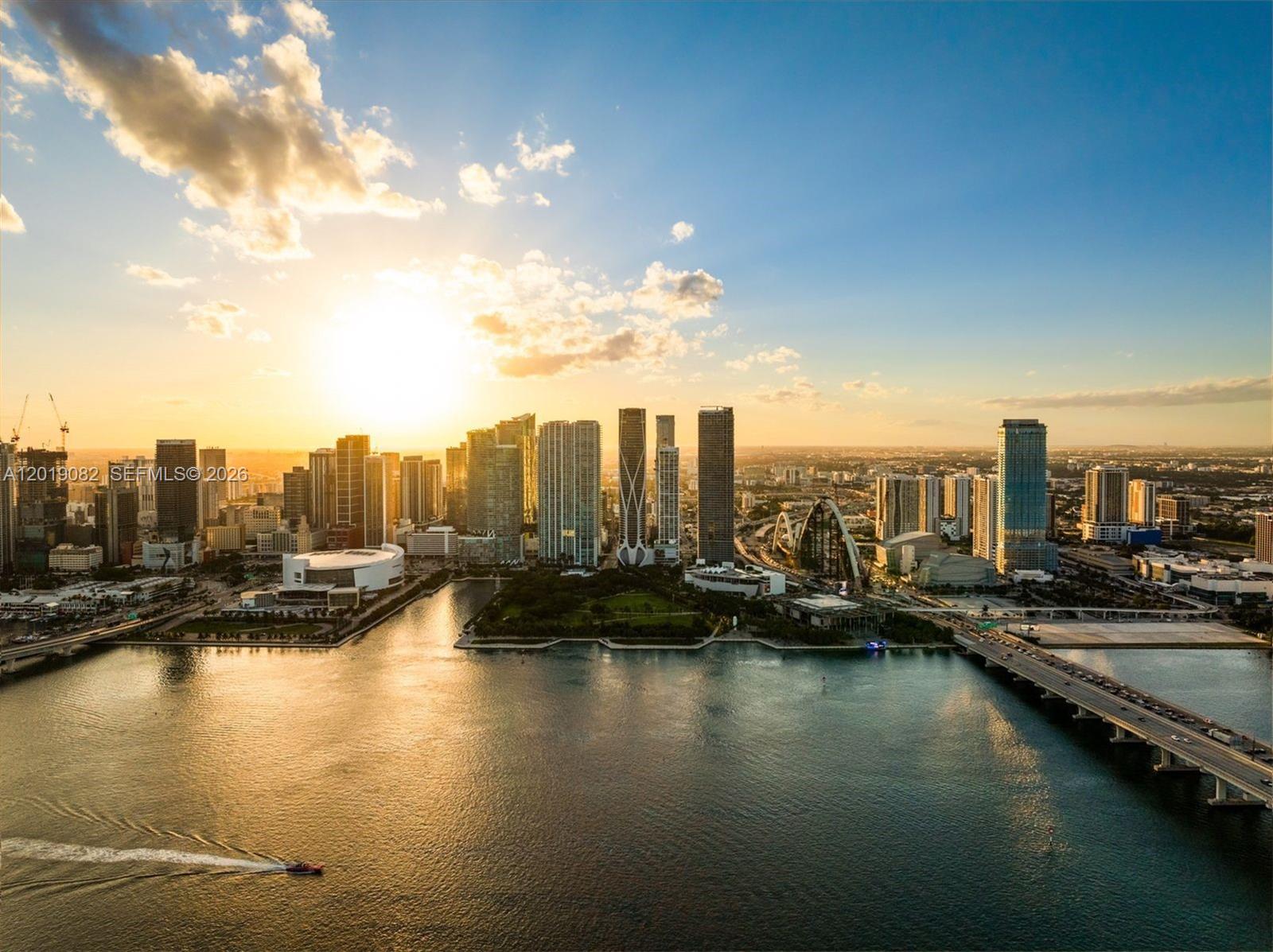 An aerial view of the Miami skyline at sunset with a bridge over the water — 1000 Biscayne Blvd # 5101, Miami FL 33132, MIAMI, FL