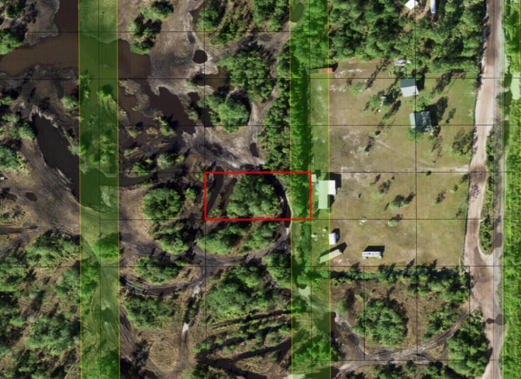 This aerial map shows a wooded lot with a red rectangle highlighting a specific area — 0 Holopaw Groves Road, FL 34772, FL