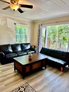 A living room features a black leather sofa, a matching futon, and a wooden coffee table — 304 SE 3rd Avenue, Delray Beach FL 33483, DELRAY BEACH, FL