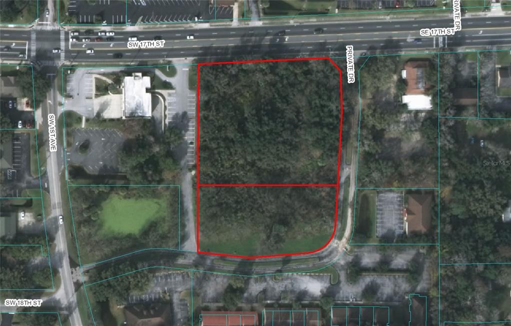 An aerial view shows a rectangular, wooded plot of land outlined in red — 150 SE 17TH STREET UNIT 2 & 3, OCALA, FL