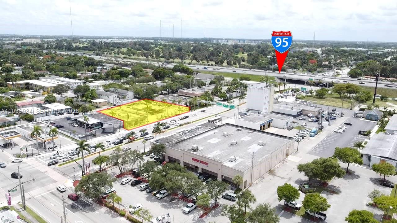 An aerial view shows a commercial property highlighted in yellow near an interstate highway — 2828 Hollywood Blvd, Hollywood FL 33020, HOLLYWOOD, FL
