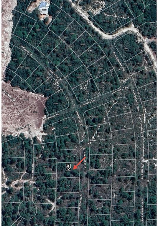 This is an aerial map showing a residential lot highlighted with a red arrow — 10640 INTERLACHER DRIVE, SEBRING, FL