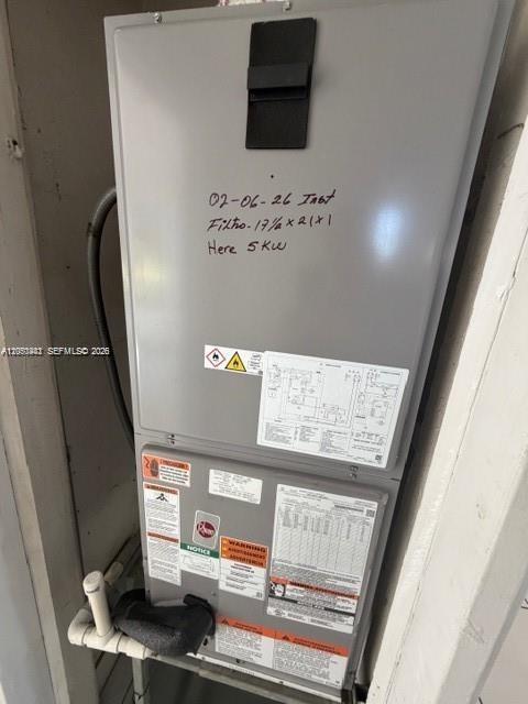 An indoor HVAC air handler unit is mounted in a small utility closet — 2368 NW 3rd St # 4, Miami FL 33125, MIAMI, FL