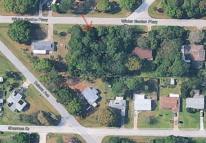 This is an aerial map view of a wooded lot located at a street intersection — 6906 Winter Garden Parkway, FL 34951, FL
