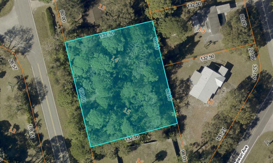 This is a satellite map view showing a rectangular, wooded residential lot highlighted in blue — 6906 Winter Garden Parkway, FL 34951, FL