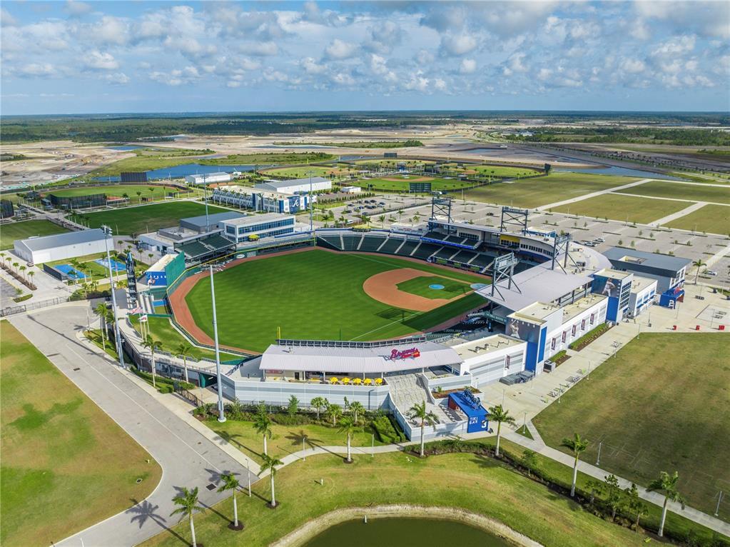 An aerial view of a baseball stadium surrounded by parking lots and undeveloped land — Lot 26, GLOBE TERRACE, NORTH PORT, FL