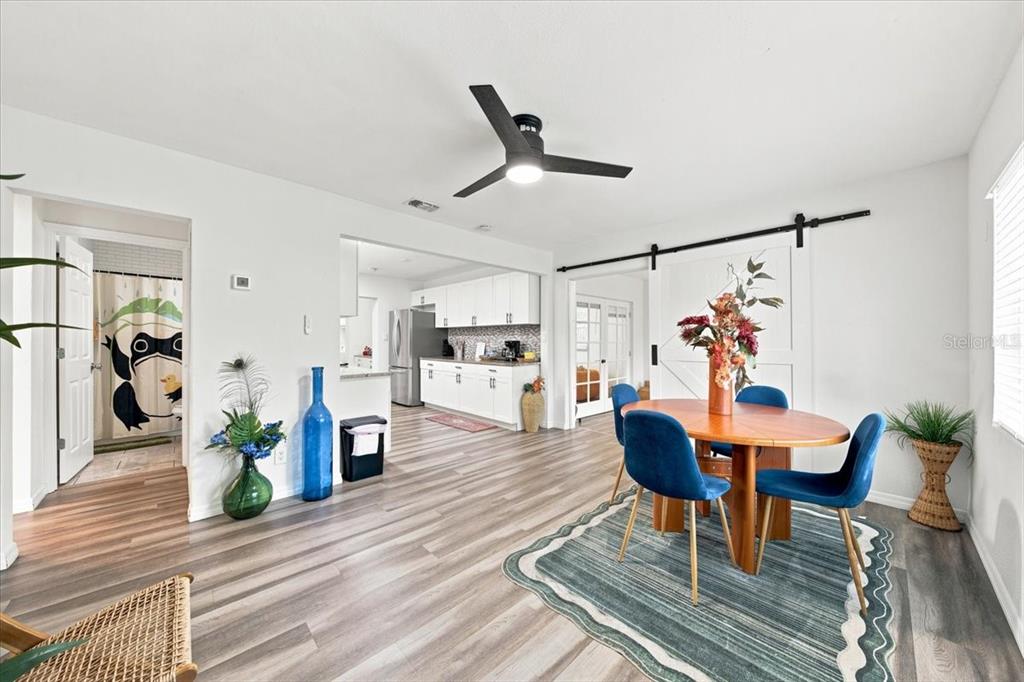 An aerial view of a single-story house with a large yard and a concrete driveway — 6350 60TH AVENUE N, ST PETERSBURG, FL