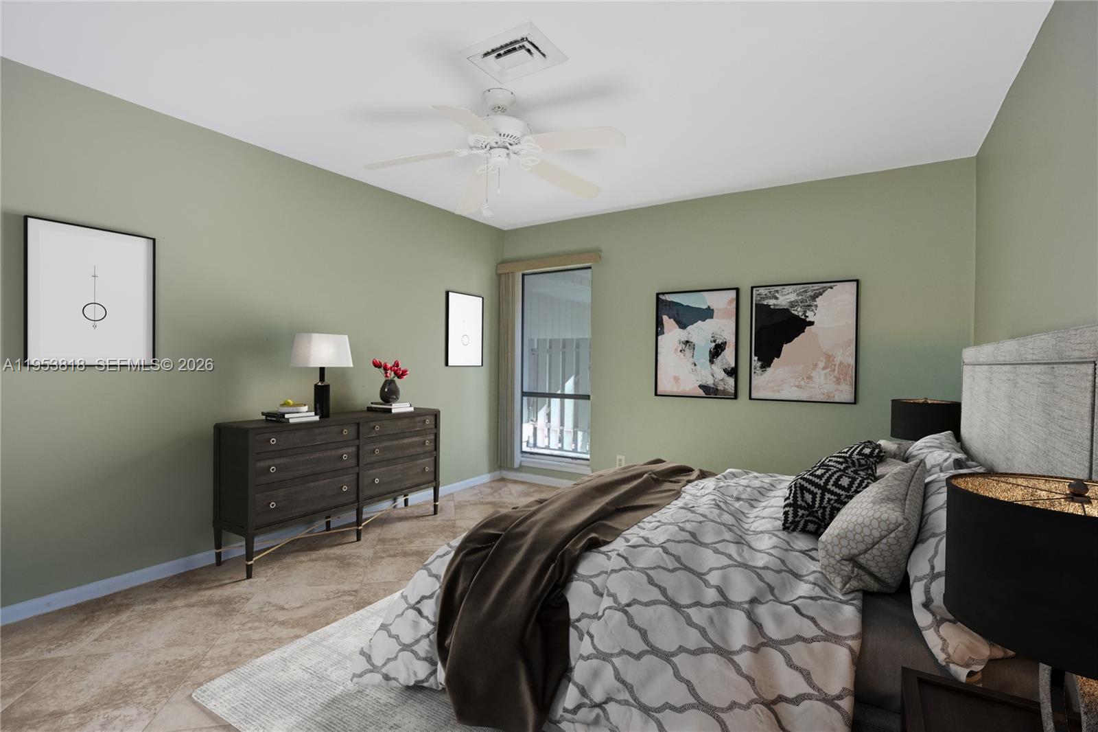 A bedroom with sage green walls, a dark dresser, and a bed with patterned bedding — 17115 Bay St, Jupiter FL 33477, JUPITER, FL