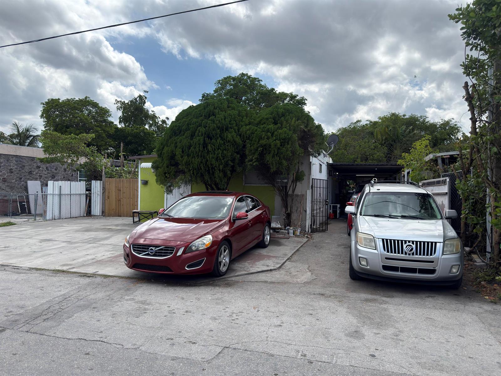 A red sedan and a silver SUV are parked in front of a house — 1320 SW 131st Place, Miami FL 33184, MIAMI, FL