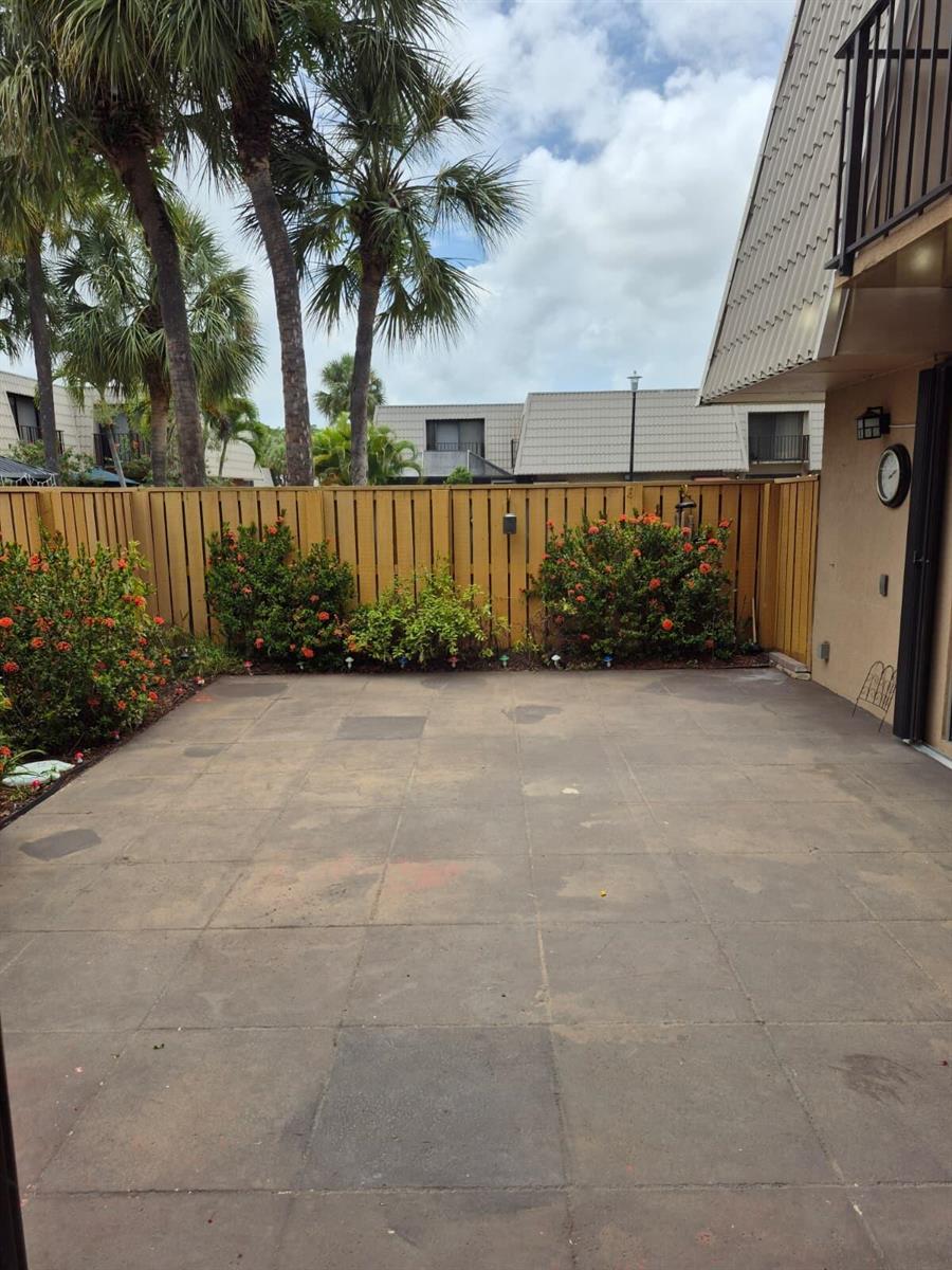 A bathroom features a glass-enclosed walk-in shower, a toilet, and a dark vanity with granite countertops — 5012 50th Way, West Palm Beach FL 33409, WEST PALM BEACH, FL