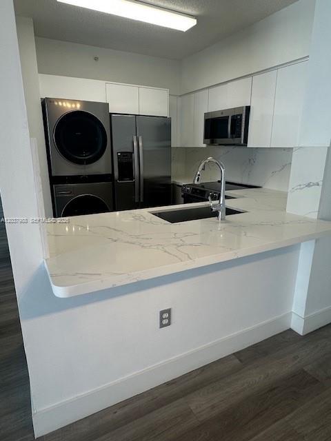 A modern kitchen features white cabinets, stainless steel appliances, and a marble-patterned quartz countertop — 5091 NW 7th St # 1008, Miami FL 33126, MIAMI, FL
