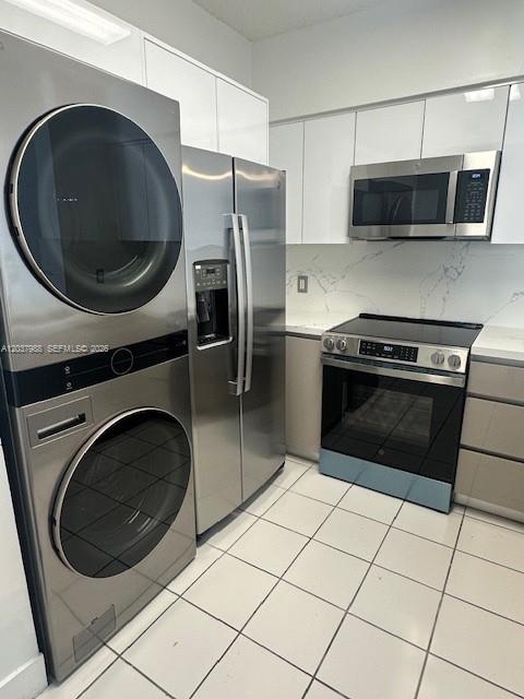 A kitchen featuring stainless steel appliances, white cabinetry, and white tile flooring — 5091 NW 7th St # 1008, Miami FL 33126, MIAMI, FL