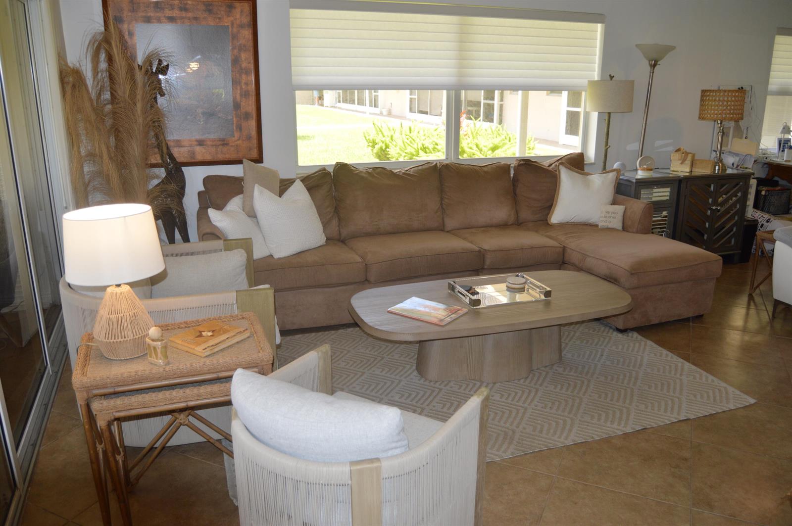 A living room features a brown sectional sofa, a coffee table, and two accent chairs — 745 SE 19th Avenue # 114, Deerfield Beach FL 33441, DEERFIELD BEACH, FL