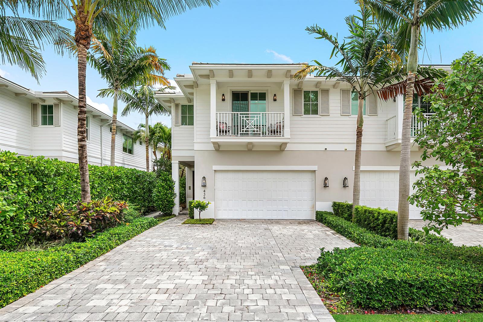 A two-story white house with a paved driveway, a garage, and a balcony — 436 NE Wavecrest Way, Boca Raton FL 33432, BOCA RATON, FL