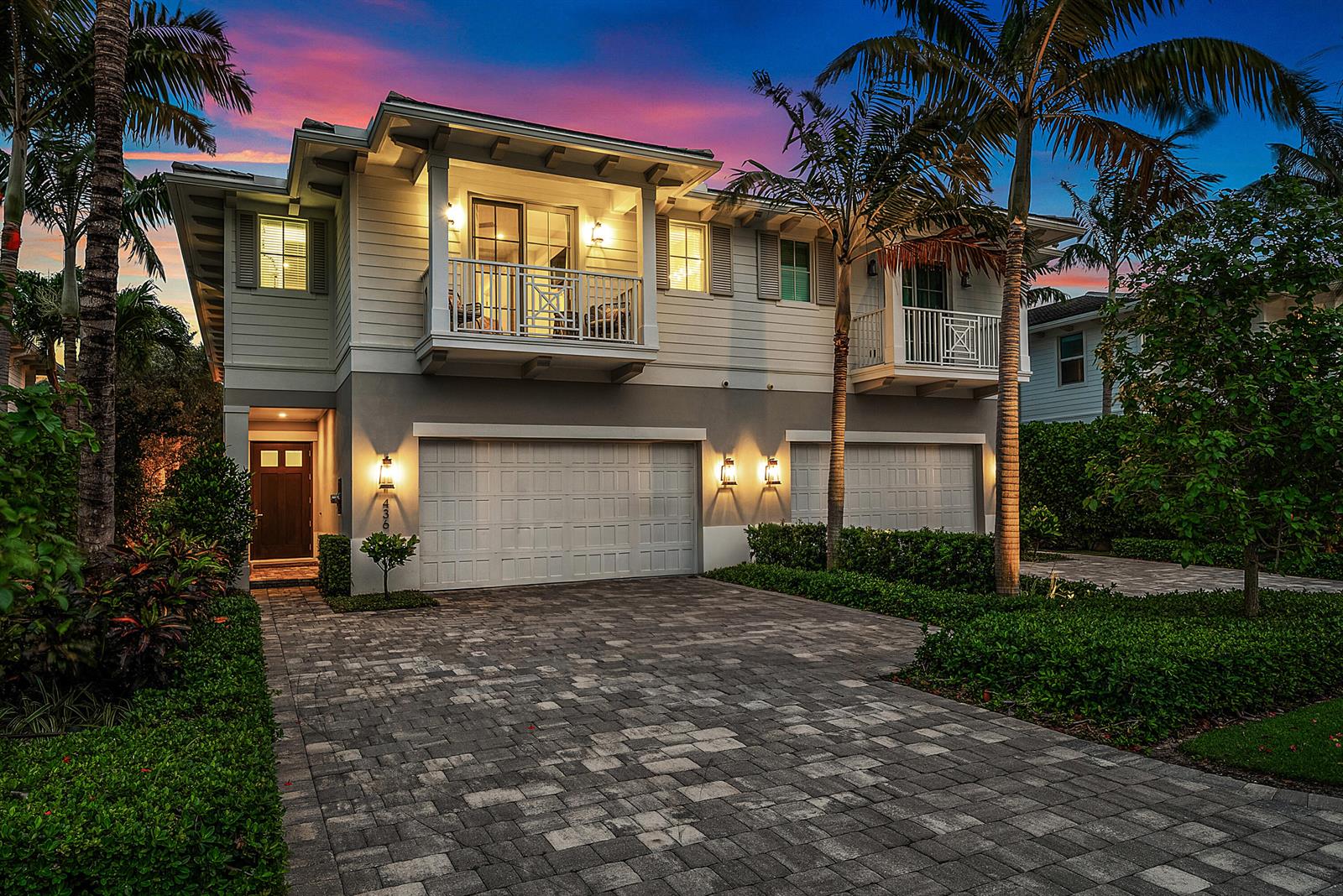 A two-story house with a paved driveway, three garage doors, and two upper-level balconies — 436 NE Wavecrest Way, Boca Raton FL 33432, BOCA RATON, FL
