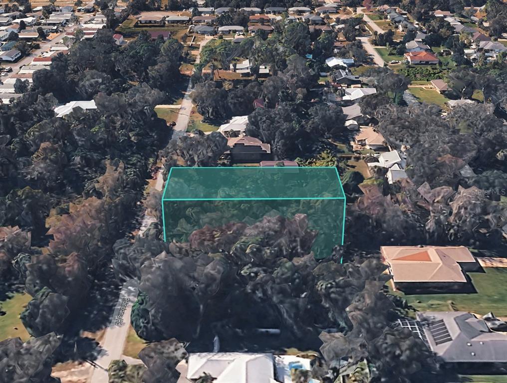 An aerial view shows a wooded residential lot highlighted with a green translucent box — POINCIANA ROAD, EDGEWATER, FL