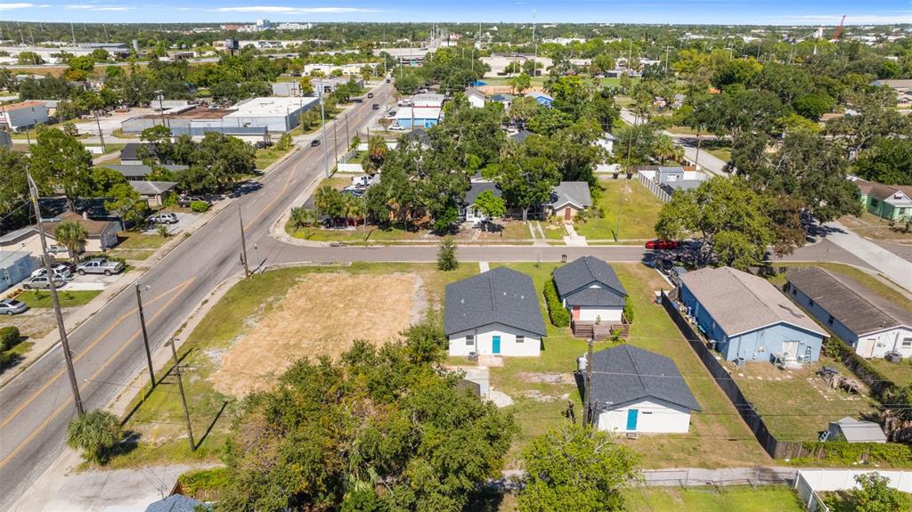 An aerial view shows two modern houses with dark roofs and white siding on a lot — 2722 14TH AVENUE S, ST PETERSBURG, FL
